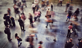 Blurred Motion Of People Walking At Railroad Station